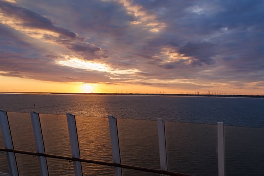 A view of the sunset from a boat photo