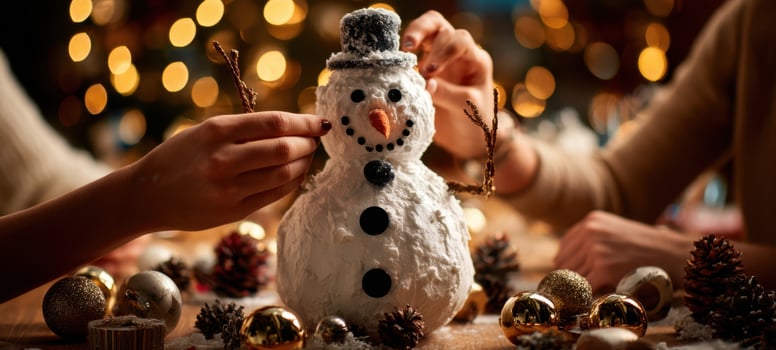 The cheerful creation of a snowman during a cozy holiday celebration photo
