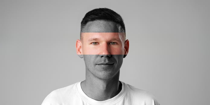 Artistic portrait of a man with abstract overlay in a minimalist setting during daylight photo