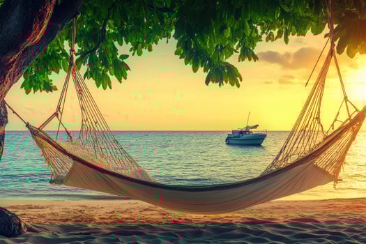Tropical beach hammock at sunset photo