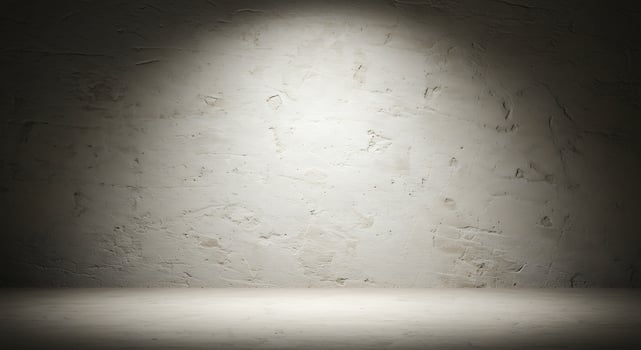 An empty room with a light shining on it photo