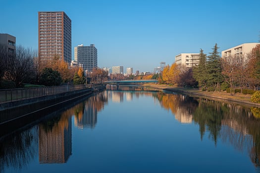 Calm urban canal reflecting buildings photo