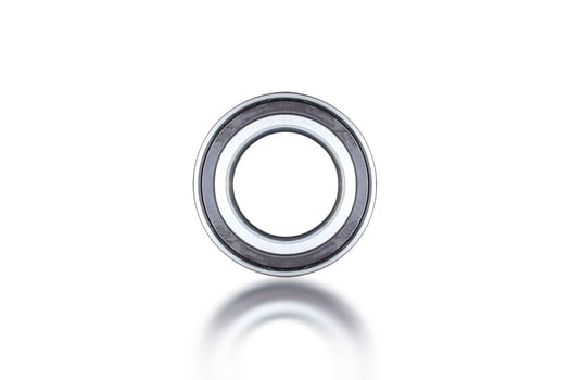 Wheel Bearing with ABS Magnet Sensor Tab, A close up of a new car wheel bearing isolated on a white background. photo