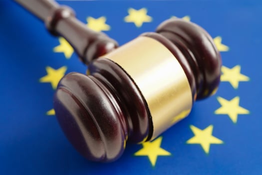 EU law, Legal, justice and agreement, wooden court gavel on flag. photo