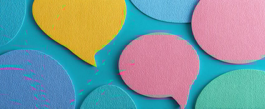 The colorful speech bubbles on a vibrant blue background create engaging communication. photo