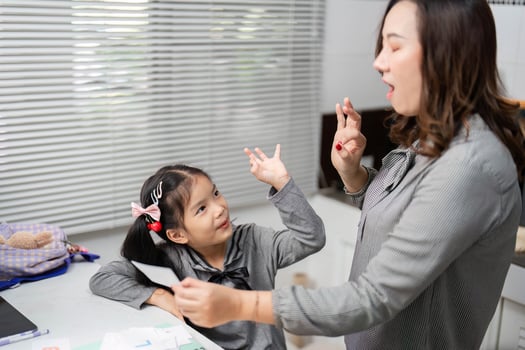 Playful Learning. Mother and Daughter Interaction in the Kitchen photo