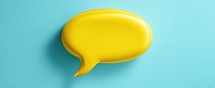 The vibrant yellow speech bubble against a bright blue background photo