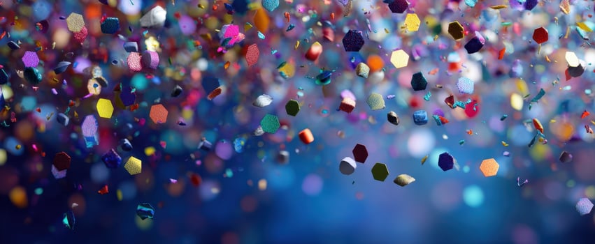 The Colorful Confetti Falling Against a Dark Blue Background photo