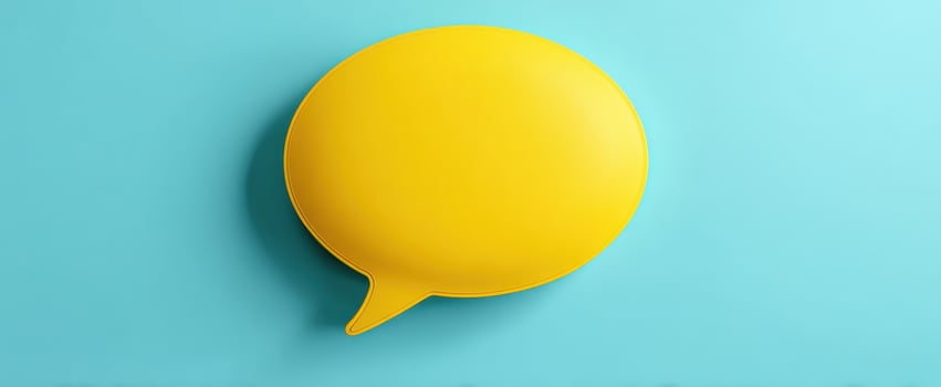 The vibrant yellow speech bubble against a calming blue background. photo