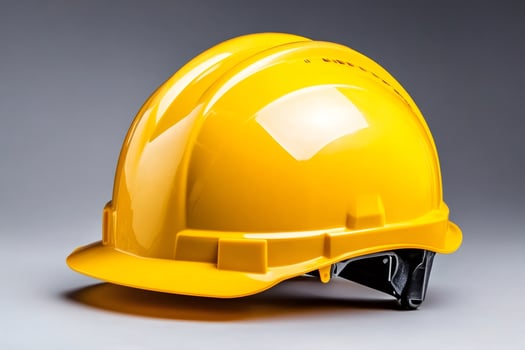 Yellow hard hat representing workplace safety and construction photo