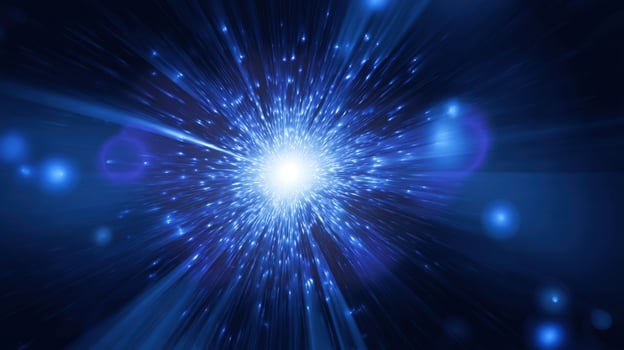 The Dynamic Burst of Cosmic Light in a Vivid Blue Background photo