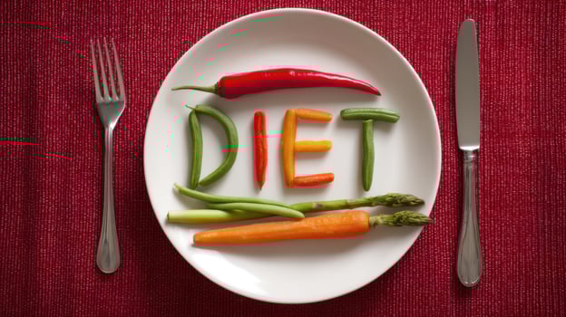 The Creative Vegetable Arrangement Spelling Out 'DIET' on a Plate photo