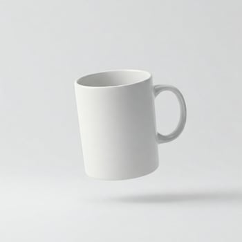 Plain white mug isolated on white photo