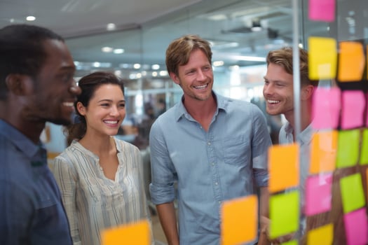 Diverse Team Engaged in Collaborative Problem Solving Using Sticky Notes for Brainstorming photo