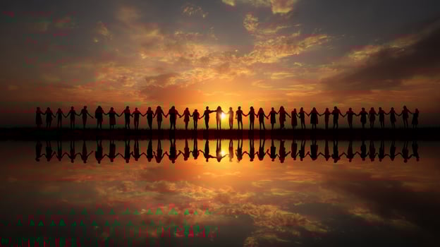 Silhouettes of People Holding Hands Against a Colorful Sunset Reflecting on Water photo