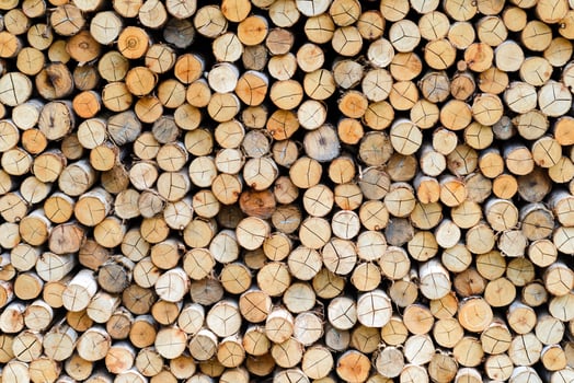 wall firewood. stacked of firewood prepare for the fireplace, barbecue, Background and texture photo