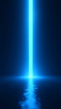 Bright blue light beam shining on water surface in dark room photo