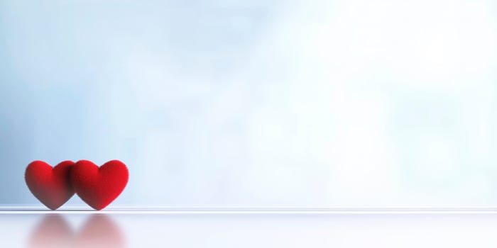 Two red hearts showing love and affection on valentine's day, romance, or anniversary celebrations photo