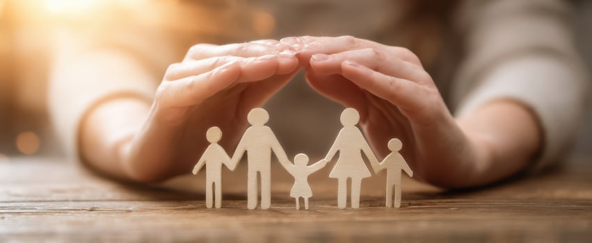 The hands providing protection and support to a loving family. photo