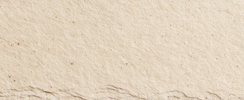 The textured surface of handmade paper in natural beige tones photo