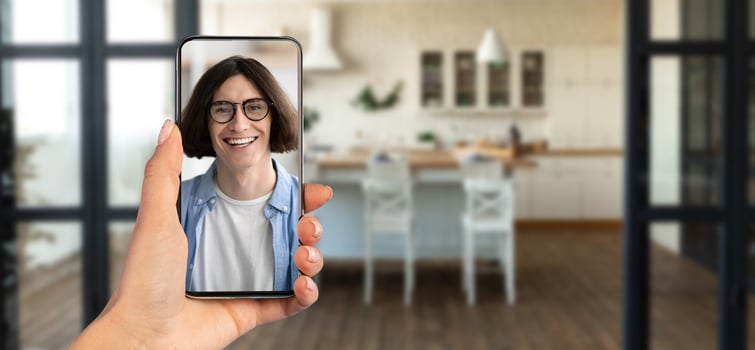 A person happily participates in an online call using a smartphone, showcasing clear communication. photo