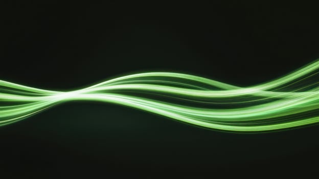 Green light trails flowing smoothly on dark background photo