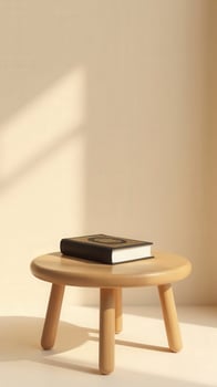 Quran book resting on wooden stool in sunlight, minimalist composition photo