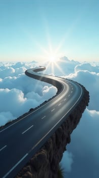 Winding road floating in the clouds towards the sun photo