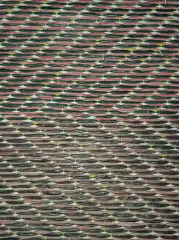 a close up of a red and green striped wall photo