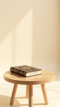 A wooden table with a book on top photo
