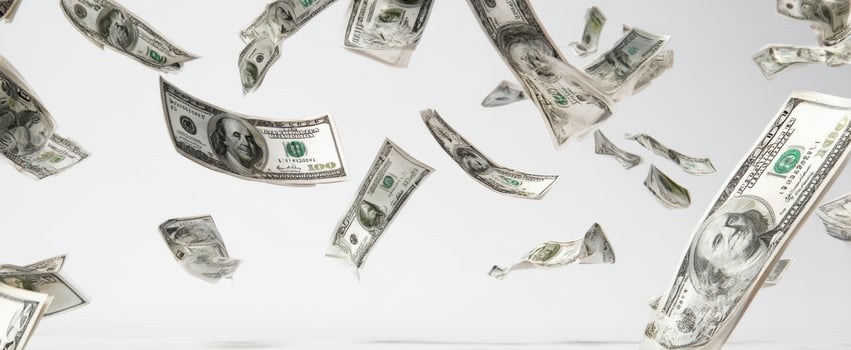 The abundance of flying dollar bills against a minimalist background. photo
