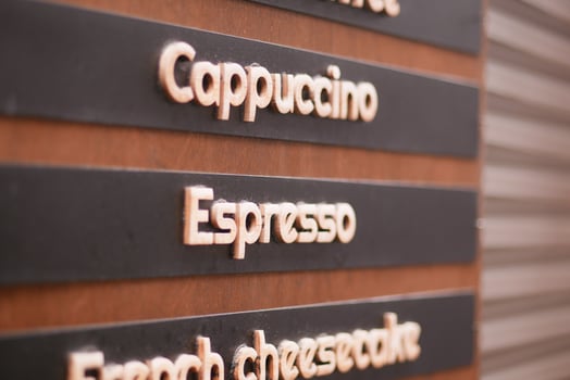 Coffee menu board featuring drinks and desserts photo