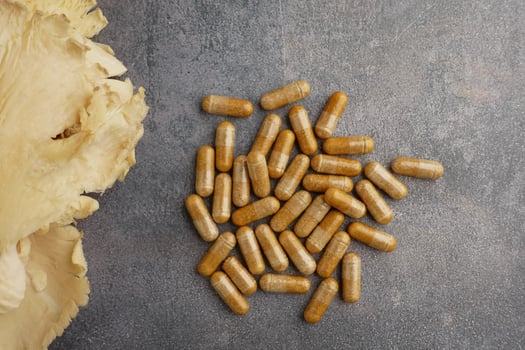 Natural health supplements with mushroom extract on table photo