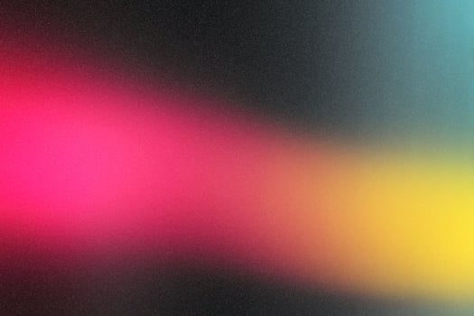 Vibrant abstract gradient with bright pink and yellow on dark background photo