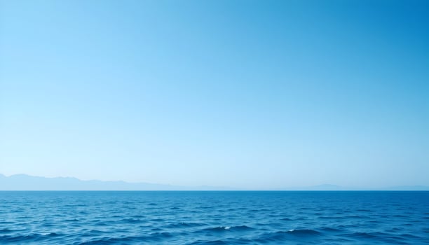 Serene Blue Ocean Distant Mountainscape Calm Water Summer Sky photo