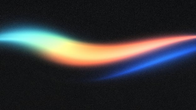 Colorful neon light streak against black background photo