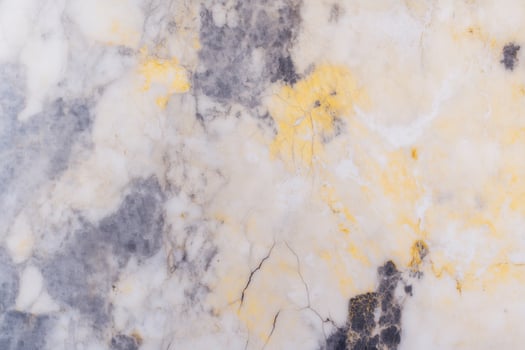 Abstract marble texture with grey and yellow patterns photo