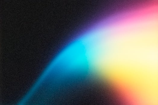 Light painting a colorful gradient on dark textured background photo
