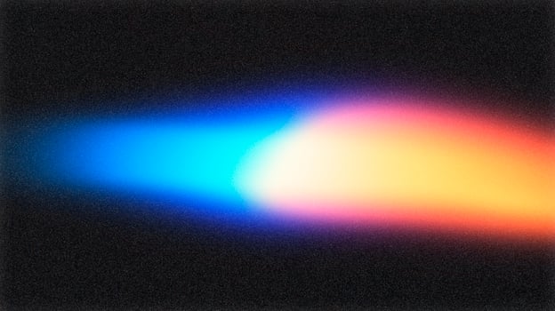 Light beam illuminating dark background creating colorful gradient effect photo