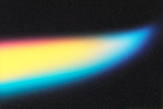 Light painting a colorful blur across a textured black background photo