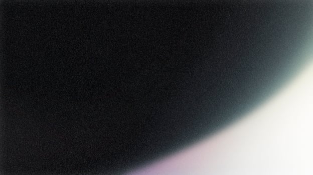 Light leak creating gradient on black background with film grain photo