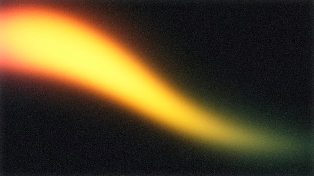 Light leak creating abstract golden light on dark background photo