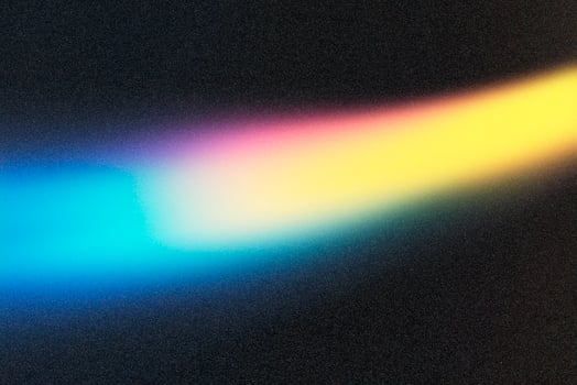 Light trails creating vibrant colors on dark background photo