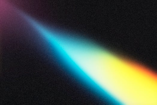Light beam creating colorful spectrum on dark background photo