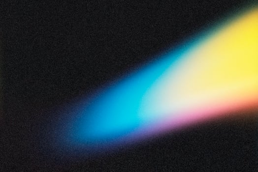 Light beam creating colorful gradient on dark background photo