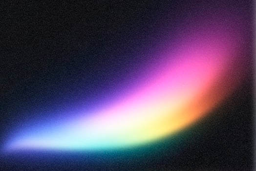 Colorful light streak shining on dark textured background photo