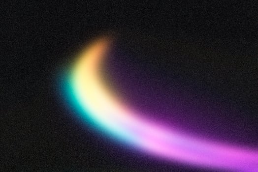 Light trails creating colorful swirls on dark background photo