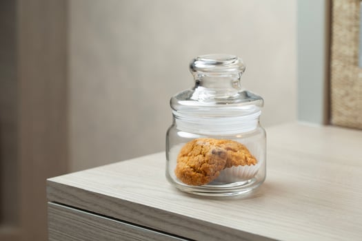 Cookies in a jar hint at a sweet break in a quiet corner photo