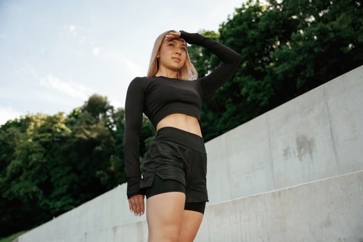 Beautiful fitness, woman,, in sport clothes is outdoors photo
