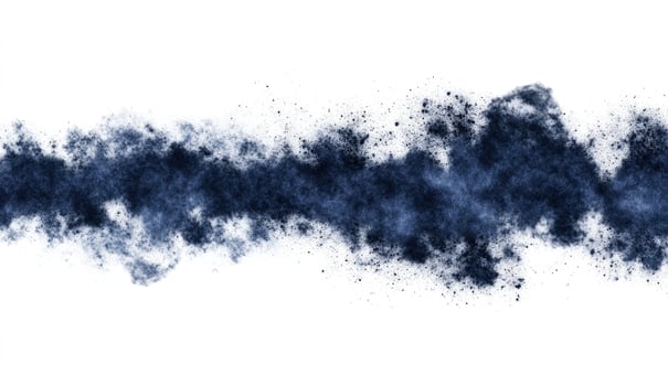 Dark blue powder explosion against white background photo